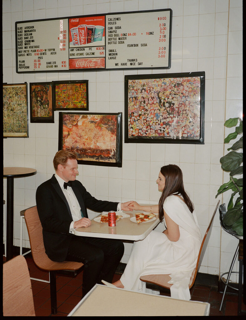 After eloping, a couple stops in for a New York slice of pizza.