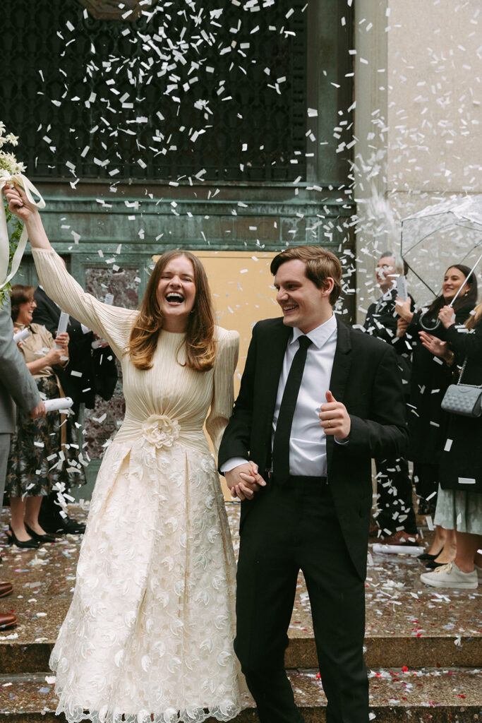 A confetti celebration outside the Manhattan Courthouse after eloping in New York City.