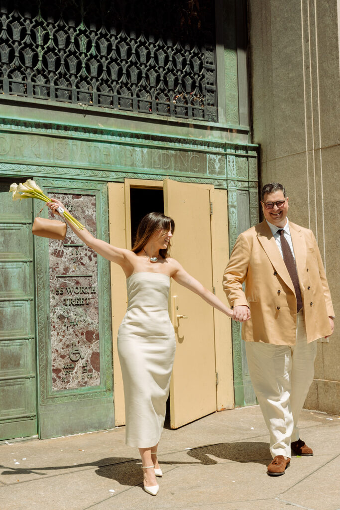 Celebrating their wedding vows after leaving the Manhattan Courthouse.