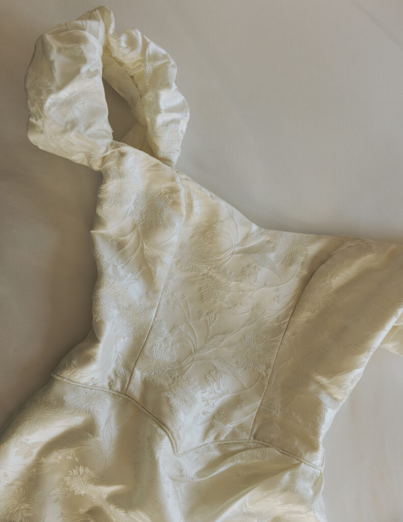 The dress found new life in a sophisticated pencil silhouette for Sarah's elopement day.