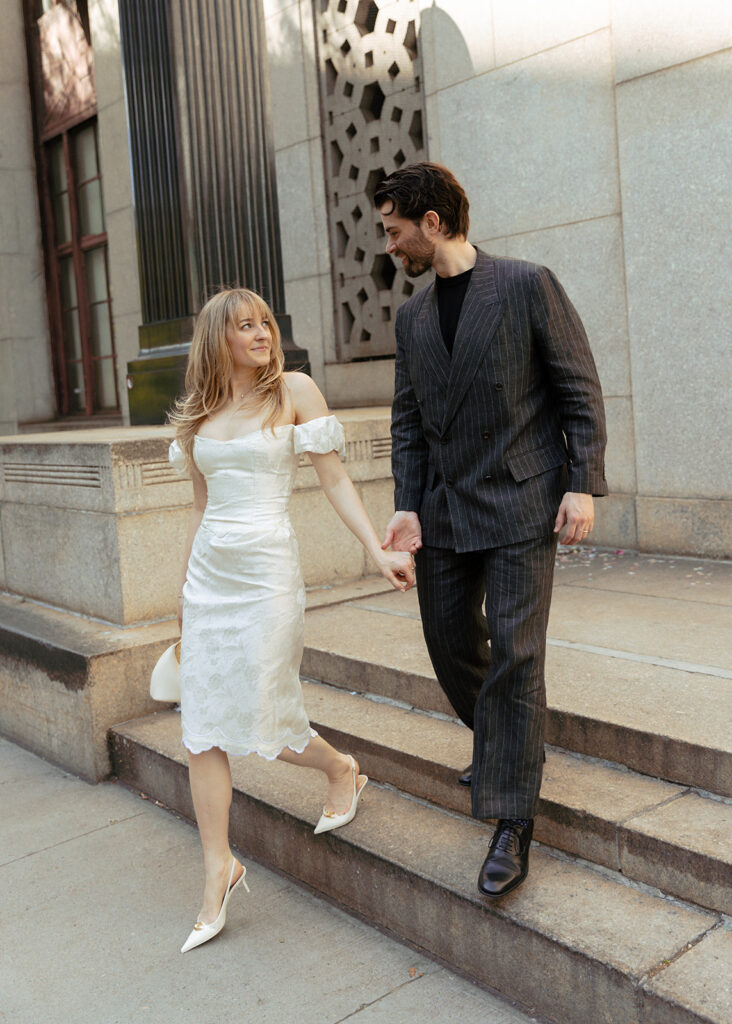 The newlyweds exiting the courthouse doors after their elopement.