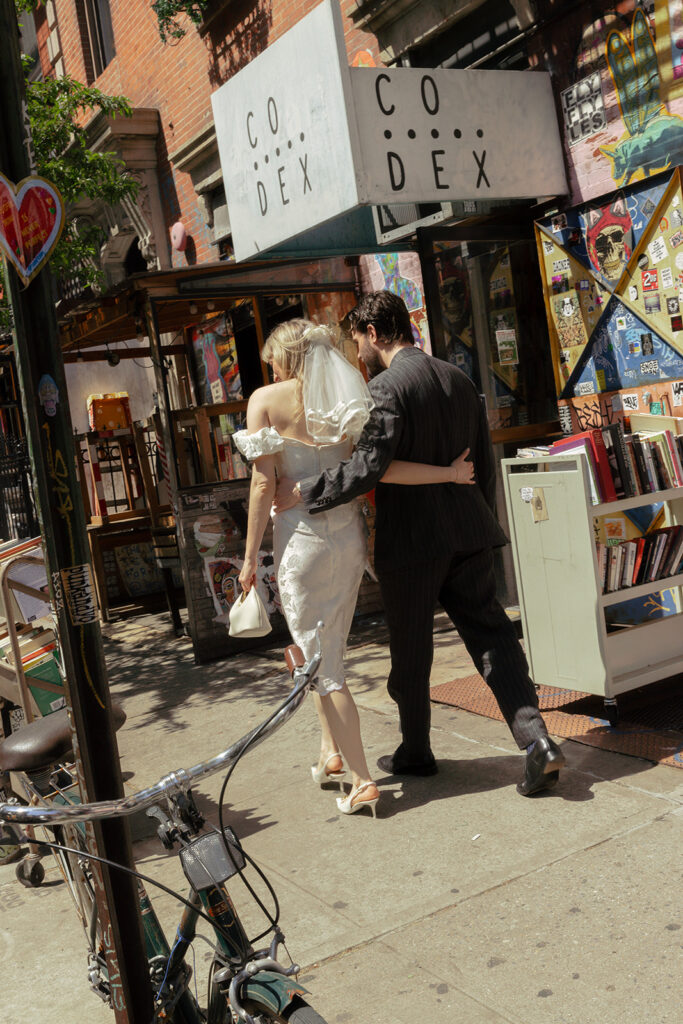 Taking a stroll through Manhattan together, enjoying little moments on elopement day.