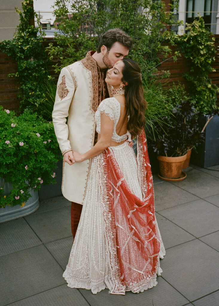 Indian wedding portraits of bride and groom captured on film in traditional clothing. 