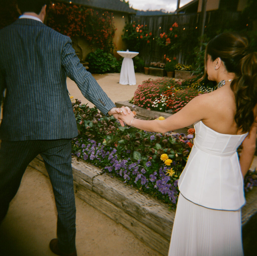 Paul leads Kismet as they enter their wedding welcome party.