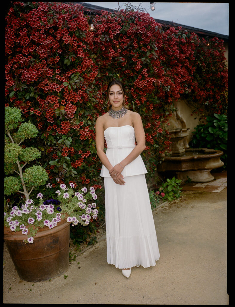 A film portrait of the bride Kismet, in black and white, at her wedding welcome party.