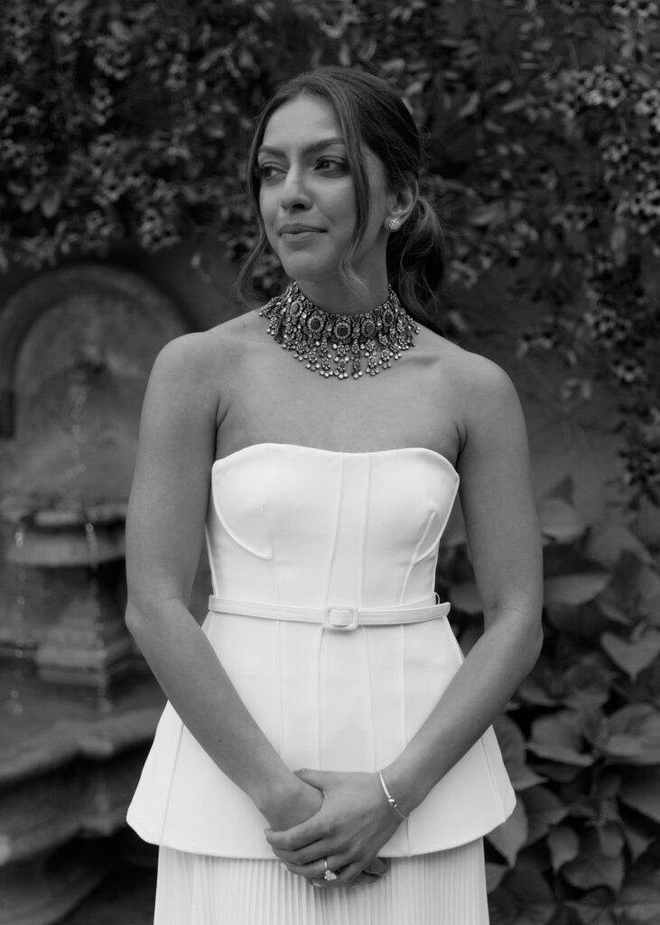 A portrait of the bride Kismet, in black and white, at her wedding rehearsal dinner.