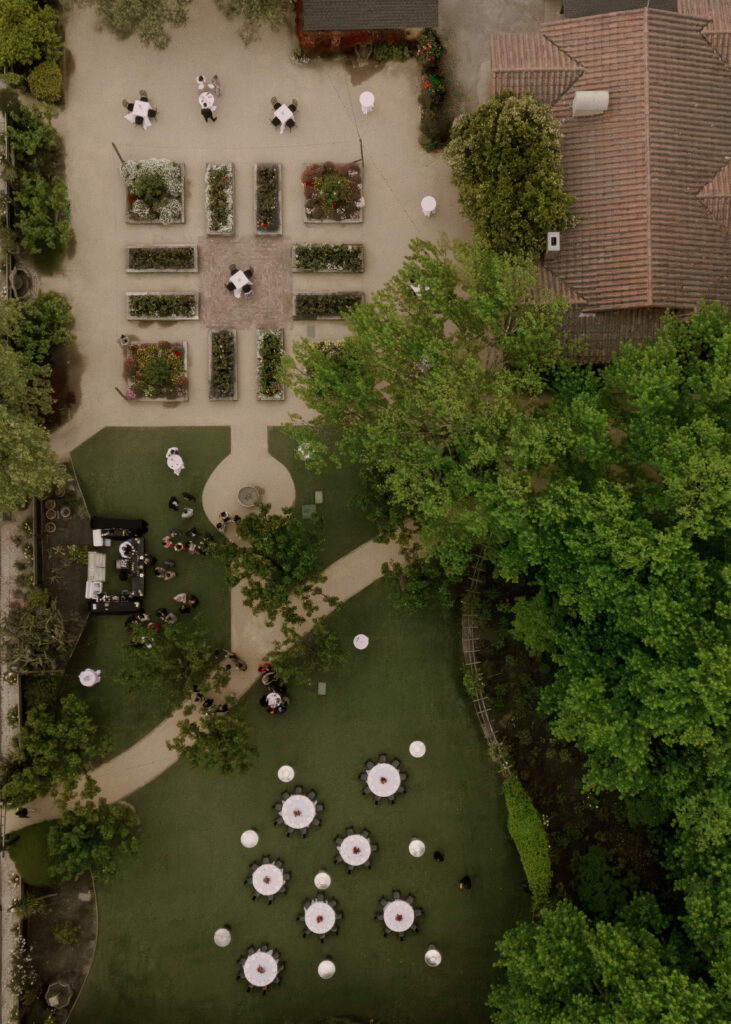 A drone overhead shot of reception details, layout and decor for Kismet and Paul's wedding rehearsal.