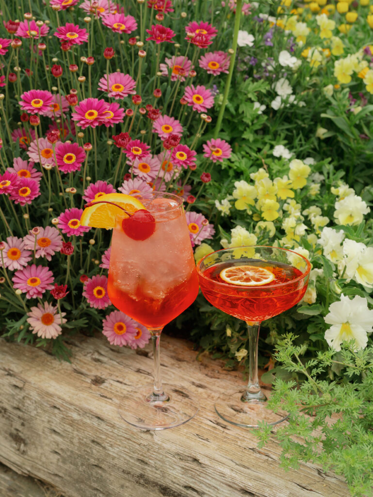 Drinks and flowers as decor for an Indian American wedding welcome party.