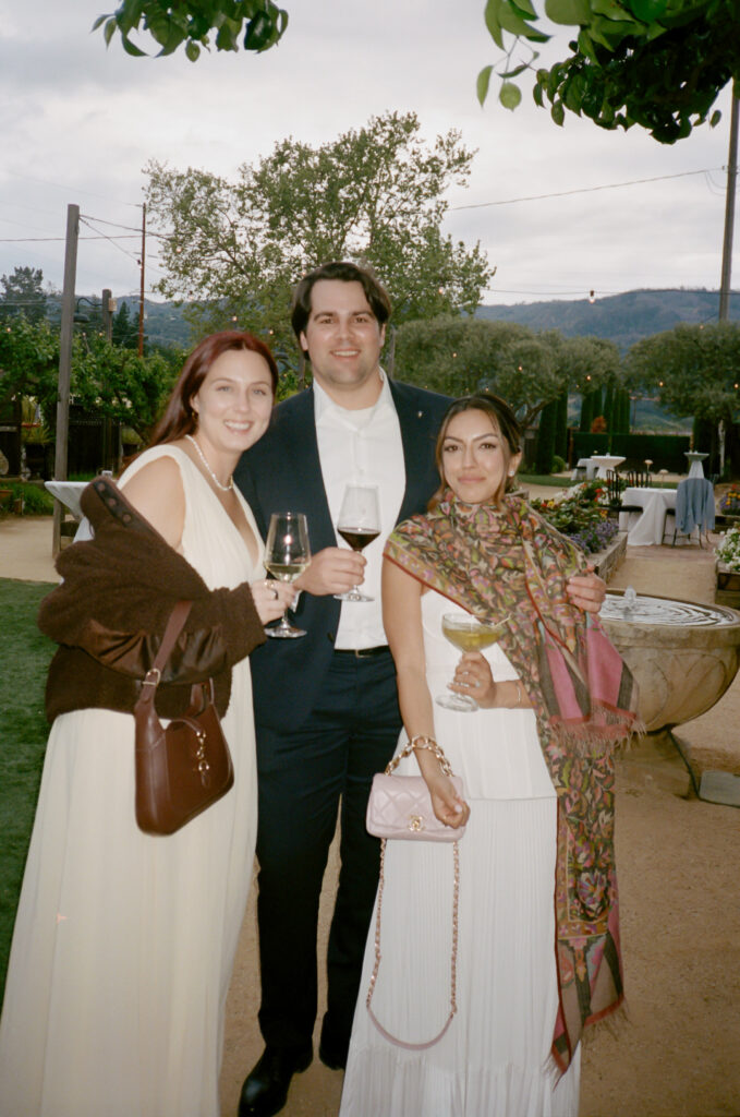 Guests with the bride at the welcome party prior to the Indian American wedding weekend.