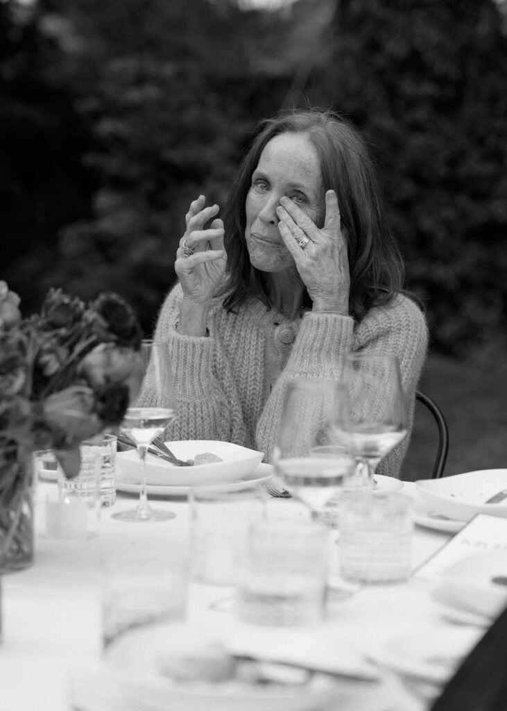 Emotional moment with guests at a multi-cultural wedding rehearsal.