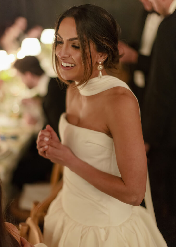 The bride and groom enjoy moments together during their wedding reception with friends and family. 