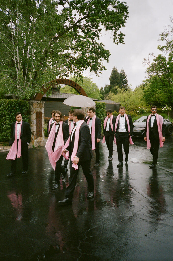The groomsmen enter ahead of Paul.