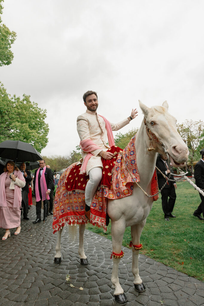 Paul rode a decorated horse, called a ghodi, as part of the baraat procession to the wedding ceremony at the Estate at Yountville.