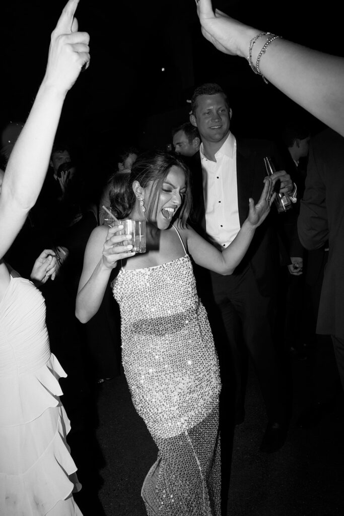 Kismet's beaded reception dress flash across the dance floor.