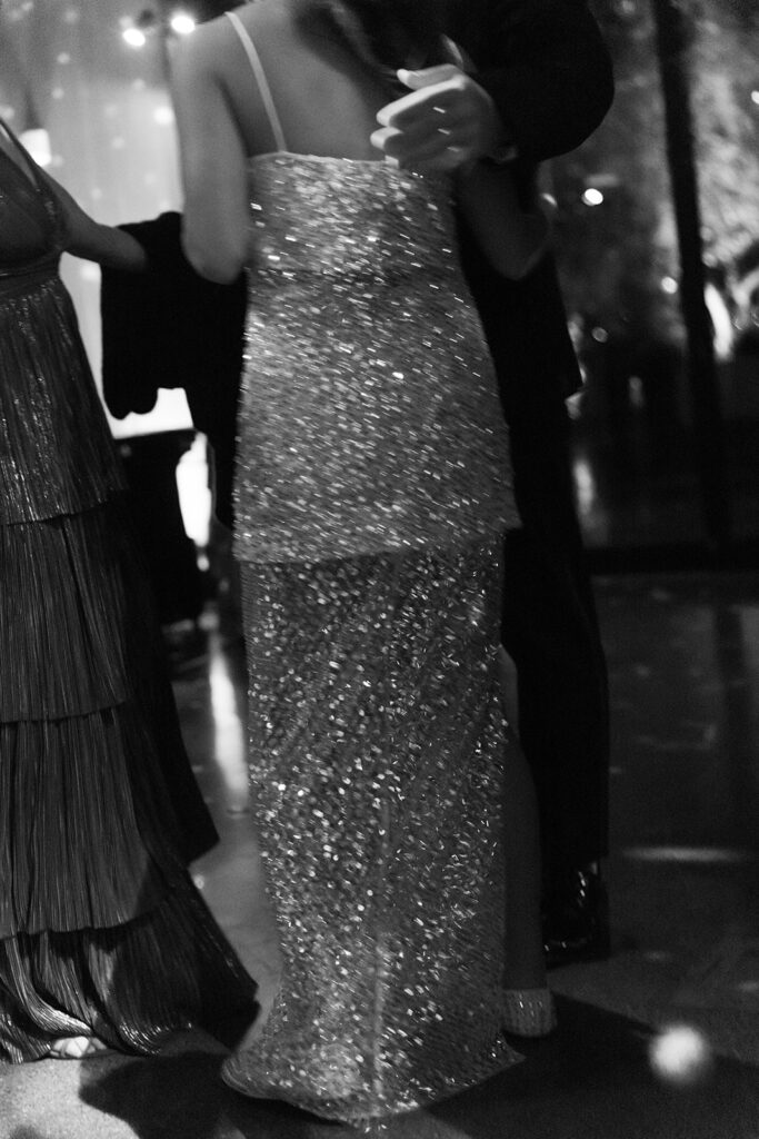 Kismet's beaded reception dress flash across the dance floor.